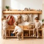 Preview: Kinder spielen und lernen selbstständig an Montessori Holz-Garderobe im warmen skandinavischen Kinderzimmer